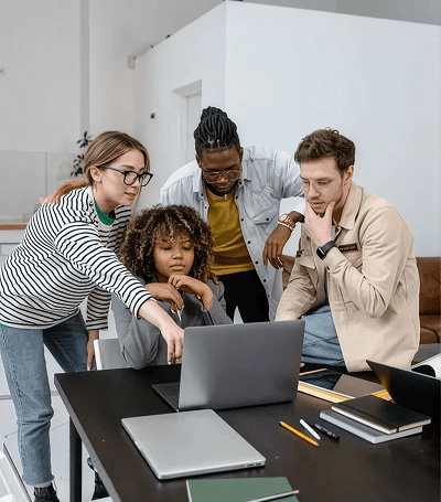 Team reviewing dashboard on a laptop