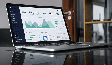 Laptop on a desk showing a cash flow dashboard